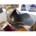 A brass helmet shaped coal scuttle, COLLECT ONLY.