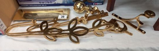 A quantity of brass fixtures and fittings including door knocker