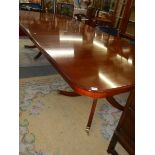 AN extending mahogany double pedestal dining table on splay feet, 305 cm long, COLLECT ONLY.