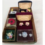 A quantity of floral brooches and earrings