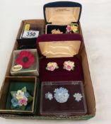 A quantity of floral brooches and earrings