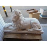 A large reclining lion garden statue, a/f to corner of base COLLECT ONLY.