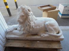 A large reclining lion garden statue, a/f to corner of base COLLECT ONLY.