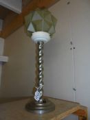 An art deco chrome barley twist table lamp with cubist green glass shade.