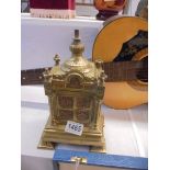 A heavy brass clock adornment.