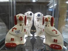 Two pairs of mid 20th century Staffordshire spaniels (Wally dogs).
