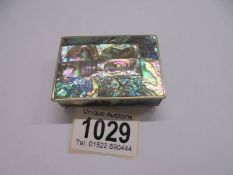 An Alpaca Mexico white metal pill box, inlaid with mother of pearl abalone shell.
