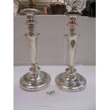 A pair of silver plate on copper candlesticks, 29cm, (plate worn)