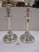 A pair of silver plate on copper candlesticks, 29cm, (plate worn)