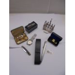 A mixed lot including toast rack, Jameson paper clip, wrist watch, buttons etc.,