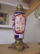 A 19th century Chinese Imari vase oil lamp base with brass fittings.