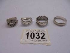Four silver rings, 18 grams.