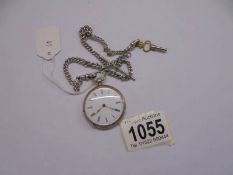 A Victorian ladies silver fob watch on silver chain, in working order, (chain 21 grams).