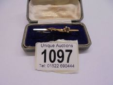 A 9ct gold bar brooch set seed pearls, 1.6 grams.