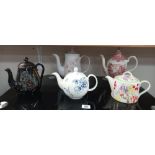 A quantity of teapots including Denby and a Victorian example (reddish colour teapot has chip to