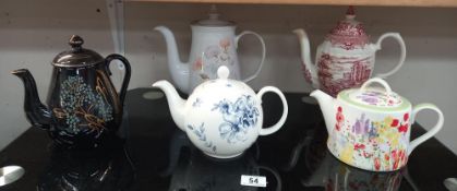 A quantity of teapots including Denby and a Victorian example (reddish colour teapot has chip to