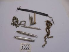 Two silver pencils, other pencils, watch chains etc.,