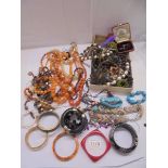 A good mixed lot of costume jewelry including necklaces, bracelets etc.,