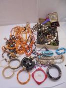A good mixed lot of costume jewelry including necklaces, bracelets etc.,