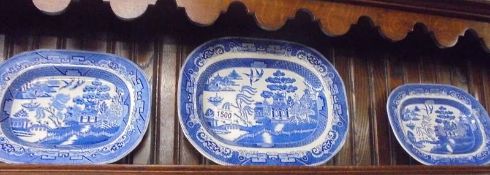 Three Wedgwood blue and white willow pattern meat platters. COLLECT ONLY.