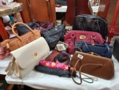 A good selection of ladies modern and vintage handbags, umbrellas, scarf, purse etc