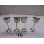 Four miniature silver goblets, (German 800).