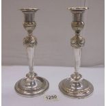 A pair of Regency style silver plate candlesticks, 25 cm.