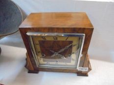 An art deco clock with key and in working order.