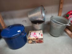 A large enamel saucepan, 3 pails (2 of which have round bottoms, so possibly fire pails) and a boxed