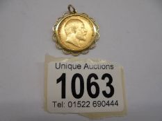 A 1910 Edward VII gold sovereign in a 9ct gold pendant mount.