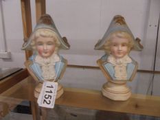 A pair of bisque porcelain paperweights in the form of busts.