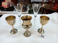 A pair of tall air twist stem glasses and 3 silver plated goblets
