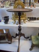 A mahogany wine table on a tripod base, 29 cm diameter, 53 cm tall. COLLECT ONLY.