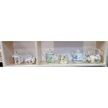 A collection of 6 teapots celebrating the artistry of the earliest teapots, fine bone china for