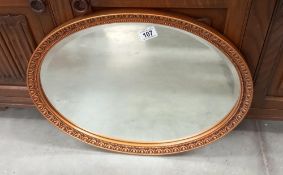 A vintage oval gilt framed bevel edged mirror COLLECT ONLY