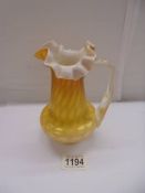 An antique yellow satin galss jug, 16 cm tall.