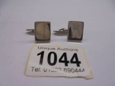 A pair of good quality silver cuff links.