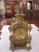 An early 19th century French enamel and gilt mantel clock in working order.