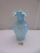 An antique blue satin glass vase, 17 cm tall.