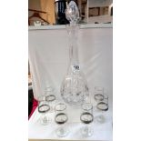 A glass decanter and 6 sherry glasses