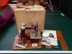 A boxed Essex miniature sewing machine