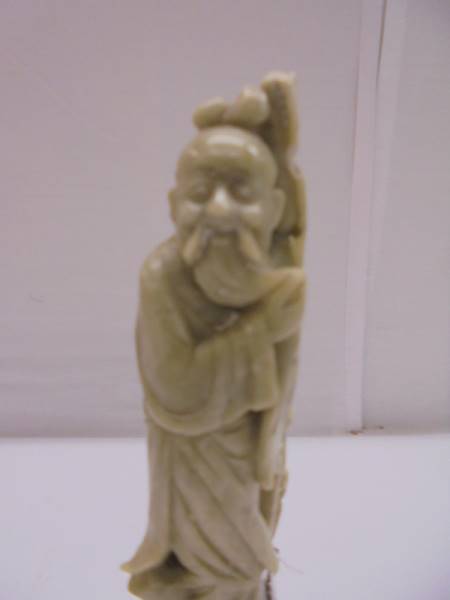 A Chinese soapstone figure of an elderly gentleman. - Image 2 of 4
