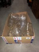 A box of oil lamp chimneys storm lanterns shades etc COLLECT ONLY