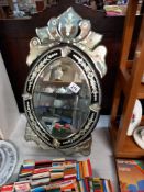 An oval gypsy style dressing table/wall hanging mirror