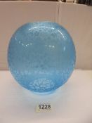 An unusual blue acid etched glass oil lamp shade, 10cm gallery size (small chip to top rim).