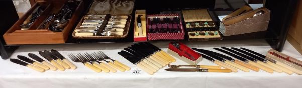 A quantity of boxed sets and loose vintage flatware cutlery