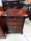 A dark wood stained 4 drawer bedroom chest COLLECT ONLY
