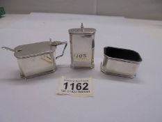 An excellent silver 1934 three piece condiment set, Birmingham, Hasset and Hanks Ltd.,