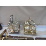 A four bottle cruet (odd bottles) and an egg cup stand.