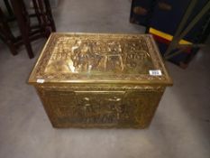 A vintage brass coated log box with relief of old pub scenes COLLECT ONLY
